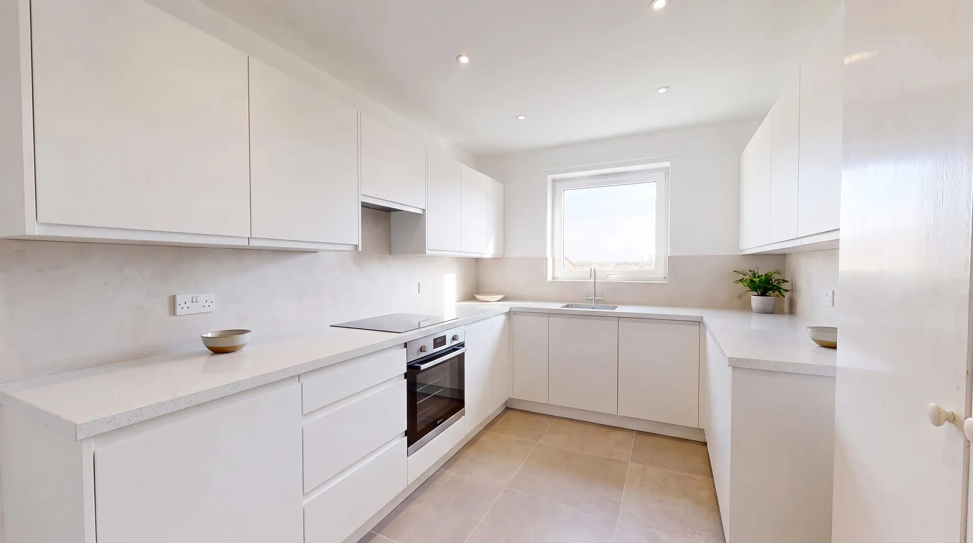 The sample kitchen with a polished white quartz countertop with a fine, even speckle