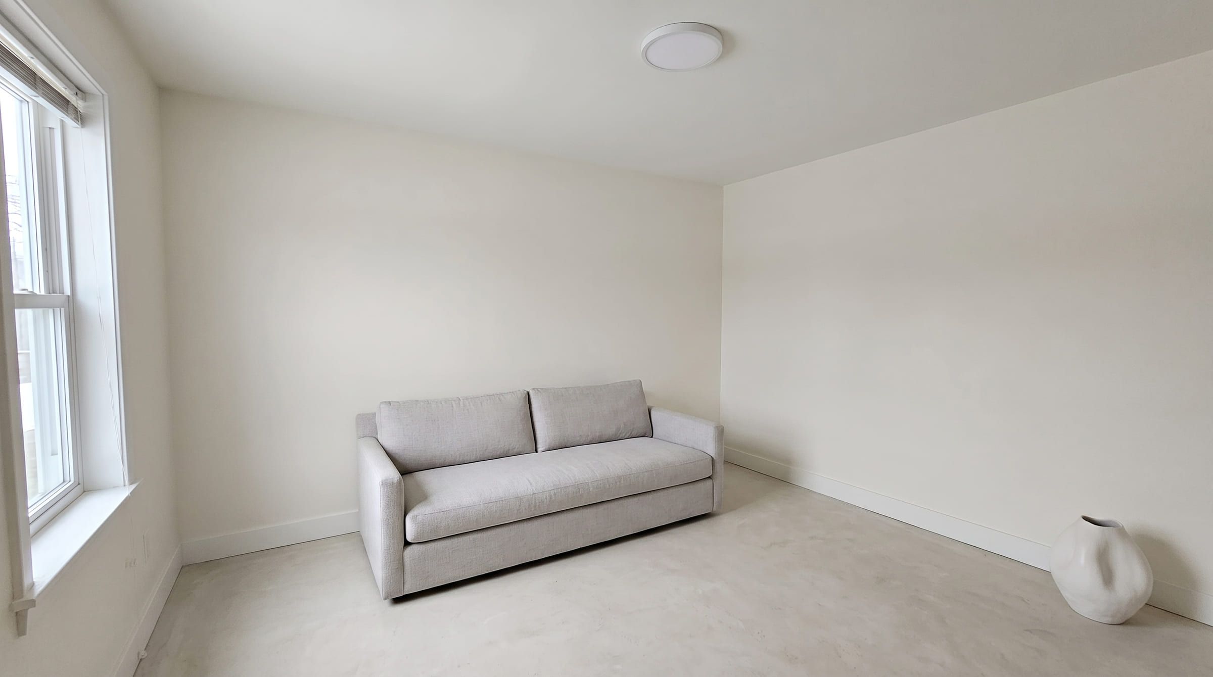 The same living room redesigned in a minimalist style