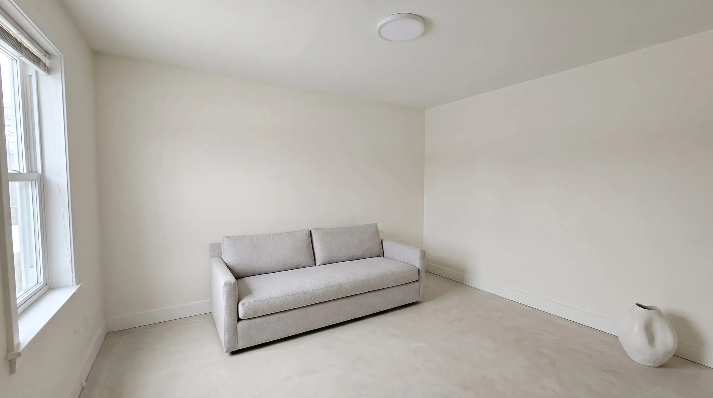 The same living room redesigned in a minimalist style